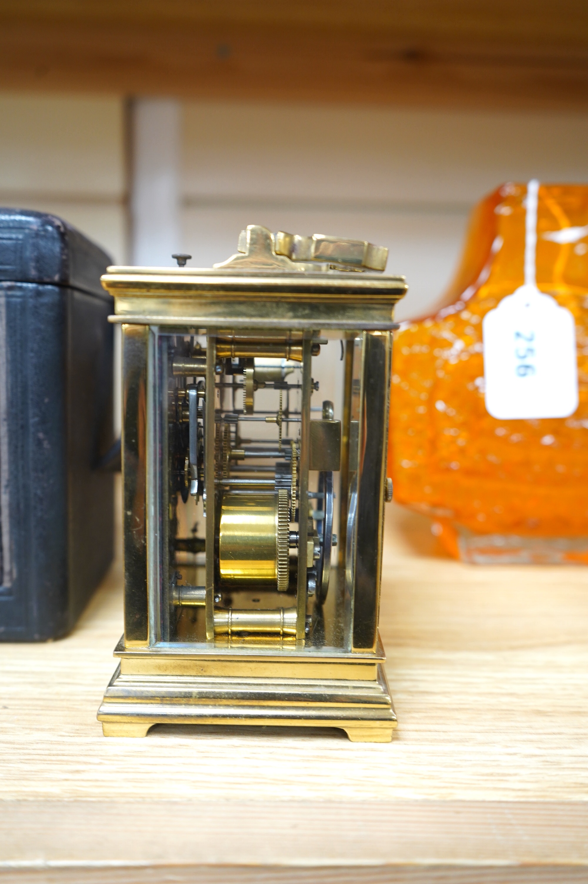 A late 19th century French brass cased eight day repeating carriage clock, Wilson & Sharp, in leather case. Condition - fair, not tested